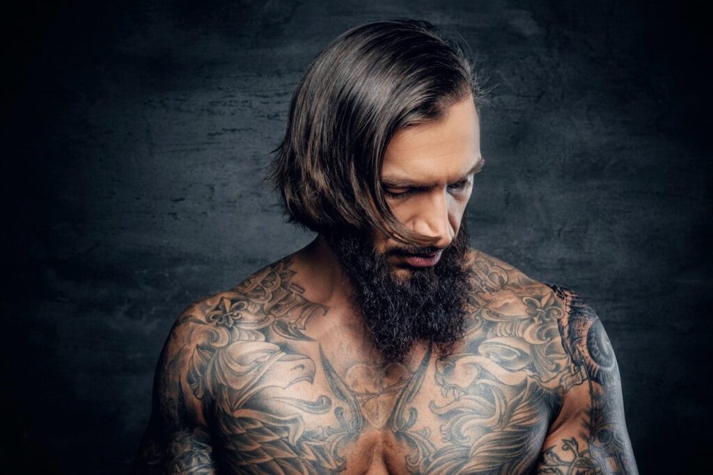 portrait-of-a-man-with-tattooed-body-e1631164186528.jpg